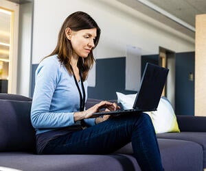 An Associate working on her laptop